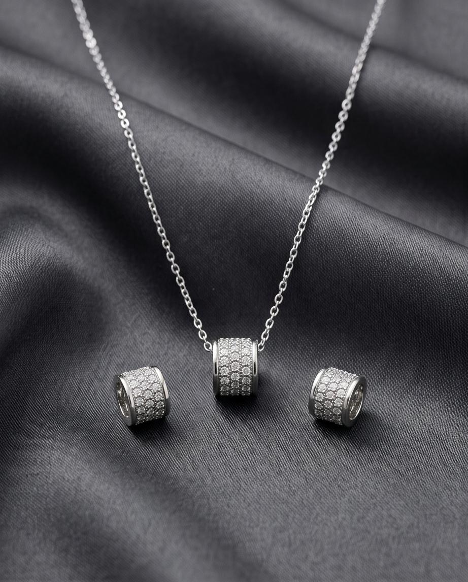 A refined silver‑tone necklace and earring set