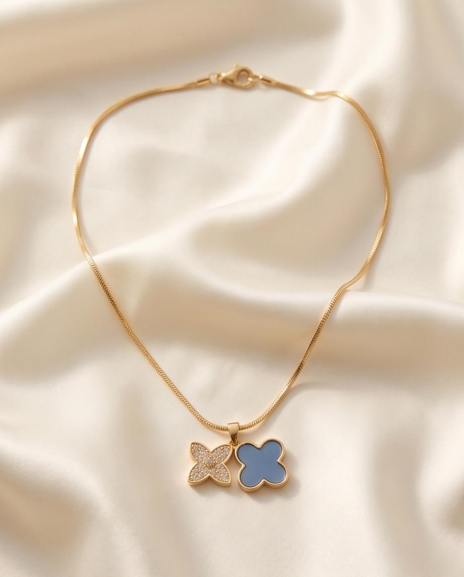 Gold‑Tone Double Clover Pendant Necklace with Crystal and Enamel Accents