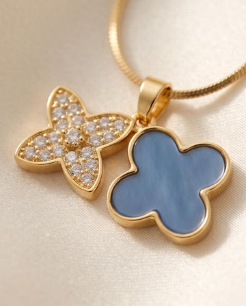 Gold‑Tone Double Clover Pendant Necklace with Crystal and Enamel Accents