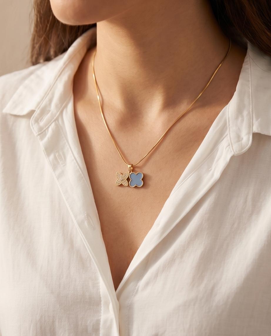 Gold‑Tone Double Clover Pendant Necklace with Crystal and Enamel Accents